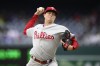 FILE - Philadelphia Phillies starting pitcher Kyle Gibson throws during the first game of the team's baseball doubleheader against the Washington Nationals, Oct. 1, 2022, in Washington. The Baltimore Orioles have agreed to a one-year contract with Gibson, adding a veteran arm to their pitching staff ahead of the winter meetings. A person familiar with the negotiations confirmed the deal to The Associated Press on Saturday night, Dec. 3, on condition of anonymity because the agreement is pending a physical. (AP Photo/Nick Wass, File)