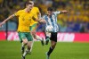 Argentina's Julian Alvarez, right, and Australia's Kye Rowles battle for the ball during the World Cup round of 16 soccer match between Argentina and Australia at the Ahmad Bin Ali Stadium in Doha, Qatar, Saturday, Dec. 3, 2022. (AP Photo/Petr David Josek)