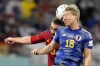 Japan's Takuma Asano, right, and Spain's Dani Carvajal go for a header during the World Cup group E soccer match between Japan and Spain, at the Khalifa International Stadium in Doha, Qatar, Thursday, Dec. 1, 2022. (AP Photo/Aijaz Rahi)