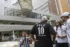 Santos soccer team supporters gather at a prayer vigil for the recovery of former soccer star Pele, in front of the Albert Einstein hospital where Pele is hospitalized in Sao Paulo, Brazil, Sunday, Nov. 4, 2022. The 82-year-old Pele has been at the hospital since Tuesday and officials say he is responding well to treatment for a respiratory infection. (AP Photo/Marcelo Chello)