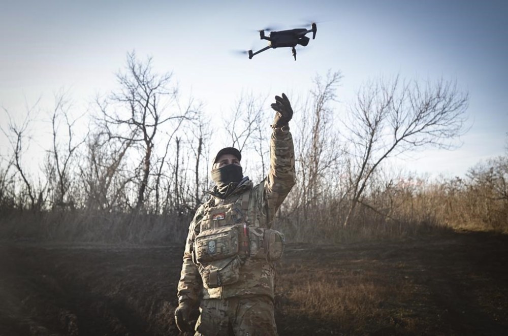 A Ukrainian serviceman flies a drone during an operation against Russian positions at an undisclosed location in the Donetsk region, Ukraine, Sunday, Dec. 4, 2022. (AP Photo/Roman Chop)