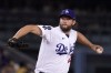 FILE - Los Angeles Dodgers starting pitcher Clayton Kershaw throws to the plate during the first inning of a baseball game against the Colorado Rockies Friday, Sept. 30, 2022, in Los Angeles. Kershaw will pitch for the Los Angeles Dodgers in 2023 after re-signing in a $20 million, one-year deal. (AP Photo/Mark J. Terrill, File)