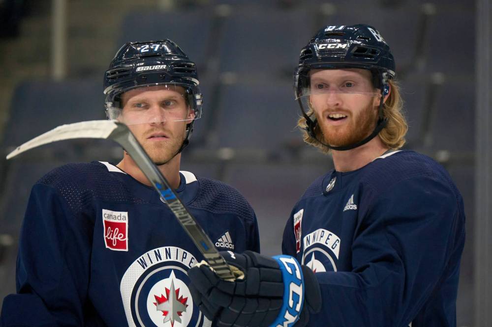 Nikolaj Ehlers’ (left) recovery from an injury is slower than hoped, while high-scoring Kyle Connor is looking to break out as he has only found the net once this season. (Mike Deal / Winnipeg Free Press files)