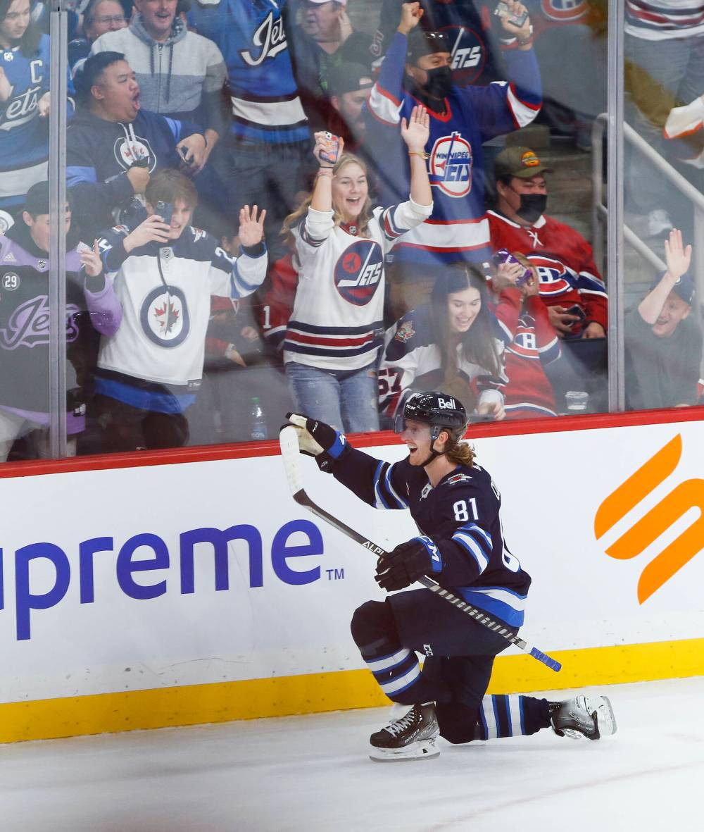 Kyle Connor celebrates his game-winning overtime goal against Montreal on Tuesday at the Canada Life Centre. (John Woods / The Canadian Press)