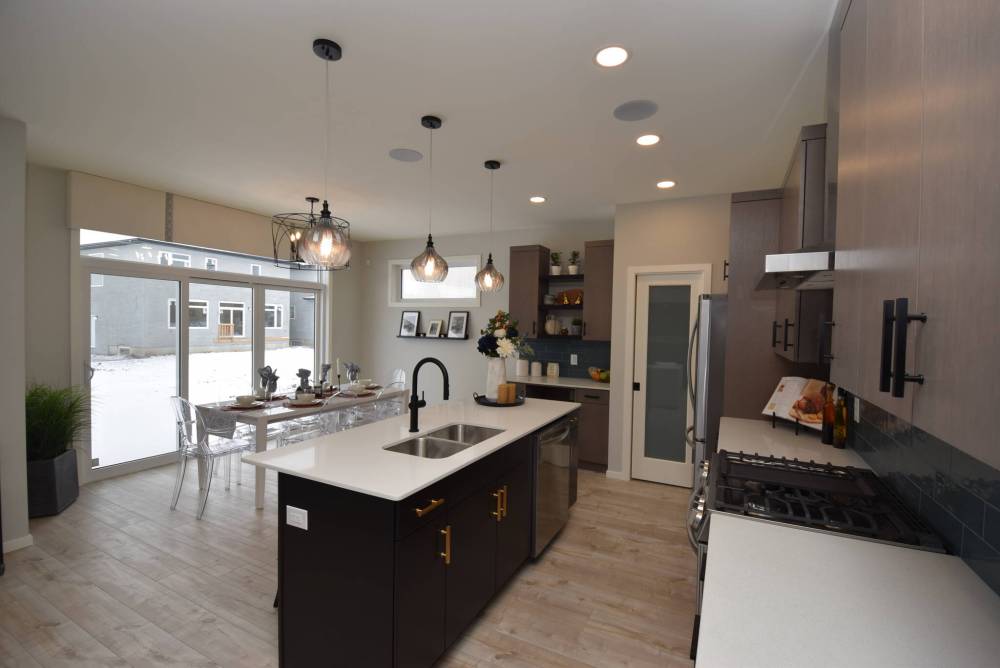 A large patio door behind the generous dining area not only adds style and function, but brings in loads of light.