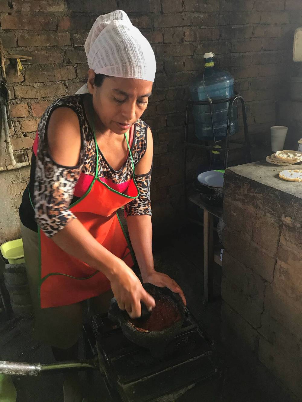 Tomasa’s tortillas start with grinding corn. It’s part of Gina Machorro’s Walking Tour.