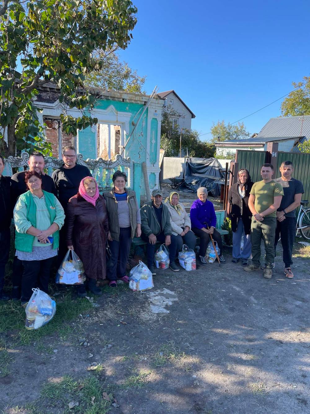 SUPPLIED
                                Gerry Michalski, second from left, with people who received food from donations provided by his church in Winnipeg.