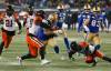 JOHN WOODS / THE CANADIAN PRESS
                                Winnipeg Blue Bombers’ Brady Oliveira (20) is tackled by BC Lions’ Mathieu Betts (90) as he makes a first down during the second half of the CFL western final in Winnipeg, Sunday.