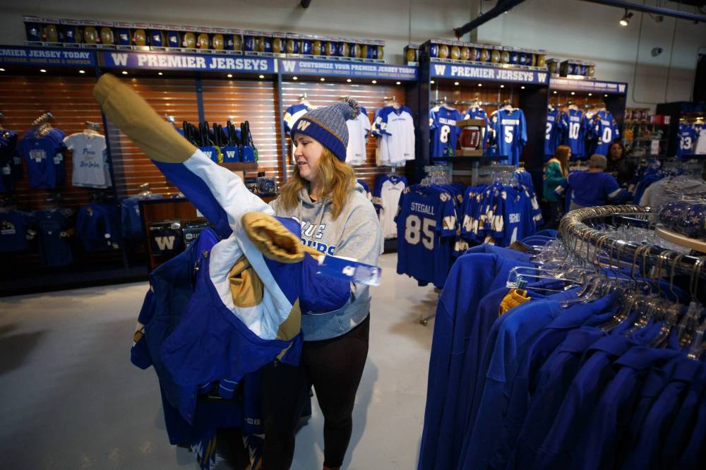 MIKE DEAL / WINNIPEG FREE PRESS
                                “I’m very excited. It’s going to be an awesome experience,” Alex Slough said while shopping at the Bomber Store.