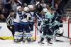 John Froschauer / The Associated Press 
                                Winnipeg Jets players celebrate with right wing Blake Wheeler (26) after he scored to tie an NHL hockey game in the final seconds as Seattle Kraken center Alex Wennberg (21) skates away during the third period Sunday, Nov. 13, 2022, in Seattle.