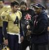 Current Argonauts coach Ryan Dinwiddie (left) made his fisrt CFL start in the 2007 Grey Cup behind centre for the Bombers after Kevin Glenn (right) was injured in the East Division final. (Adrian Wyld / The Canadian Press files)
