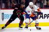 Paul Stastny (left) battles for the puck against New York Islanders Mathew Barzal during the third period of an NHL hockey game in Raleigh, N.C., last month. (Karl B. DeBlaker / Associated Press files)