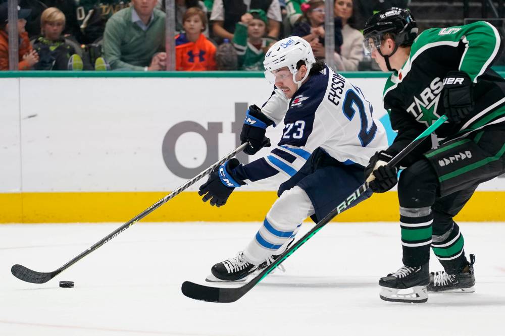 Winnipeg Jets’ Michael Eyssimont skates with the puck against Dallas Stars defenceman Nils Lundkvist during the second period in Dallas, Friday. (AP Photo/LM Otero)