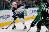 LM Otero / The Associated Press
                                Winnipeg Jets defenseman Neal Pionk (4) skates with the pucks against Dallas Stars left wing Jason Robertson (21) during the first period of an NHL hockey game in Dallas, Friday, Nov. 25, 2022.