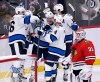 FRED GREENSLADE / THE CANADIAN PRESS
Winnipeg Jets' Nate Schmidt (88) celebrates his goal against Chicago Blackhawks goaltender Dylan Wells with Neal Poink (4), Blake Wheeler (26) and Adam Lowry (17) during the third period Saturday.