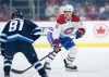 JOHN WOODS / THE CANADIAN PRESS
Montreal Canadiens' Johnathan Kovacevic (26) defends against Winnipeg Jets' Kyle Connor (81) during first period NHL action in Winnipeg.