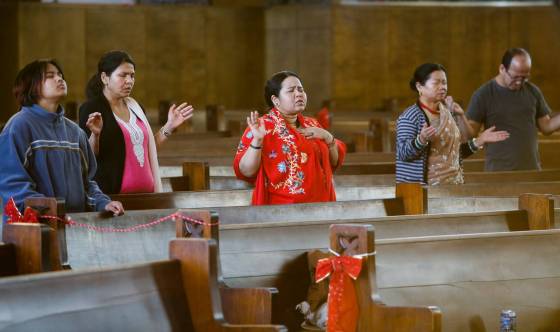 Parishioners participate in a Nepalese service at Knox United Church in Winnipeg on Sunday. (John Woods / Winnipeg Free Press)