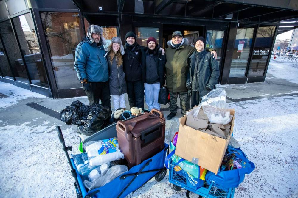 DANIEL CRUMP / WINNIPEG FREE PRESS
Josh Maxwell (from left), Nicole Wiebe, Marc Sweet, Joshua Goddard, Quentin Gabriel and Daniel Peterson are volunteers from Warmer Hearts Winnipeg.
