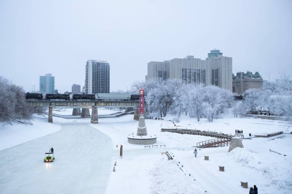 A Zamboni helps ready the river trail at the Forks in Winnipeg on New Year’s Eve. (Daniel Crump / Winnipeg Free Press)