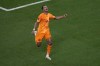 Cody Gakpo of the Netherlands celebrates scoring his side's first goal during the World Cup group A soccer match between the Netherlands and Qatar, at the Al Bayt Stadium in Al Khor , Qatar, Tuesday, Nov. 29, 2022. (AP Photo/Ariel Schalit)