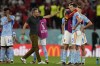 Spain's head coach Luis Enrique, center, talks to his players after the penalty shootout at the World Cup round of 16 soccer match between Morocco and Spain, at the Education City Stadium in Al Rayyan, Qatar, Tuesday, Dec. 6, 2022. (AP Photo/Luca Bruno)