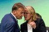 FILE -- Donata Hopfen, right, then managing director of DFL GmbH, and Hans-Joachim Watzke, left, chairman of the DFL supervisory board, talk during a DFL meeting in Dortmund, Germany, Wednesday, Aug. 17, 2022. The German soccer league is replacing its first ever female CEO with two men. Hopfen is leaving her role as the head of Germany’s top two soccer divisions after less than a year in charge. (Bernd Thissen/dpa via AP,file)