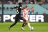 Canada midfielder Ismael Kone (15) and Croatia midfielder Luka Modric (10) battle for the ball during second half group F World Cup soccer action at the Khalifa International Stadium in Al Rayyan, Qatar, Sunday, Nov. 27, 2022. A year and a half after being invited to the CF Montreal first-team training camp, Kone's profile has skyrocketed, earning a call-up to Canada's first World Cup squad since 1986 and a move to English club Watford F.C. THE CANADIAN PRESS/Nathan Denette