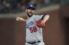 FILE - Los Angeles Dodgers' Chris Martin pitches during the team's baseball game against the San Francisco Giants in San Francisco, Aug. 2, 2022. Martin and the Boston Red Sox finalized a $17.5 million, two-year contract Thursday, Dec. 8. (AP Photo/Jeff Chiu, File)