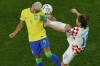 Croatia's Luka Modric, right, fights for the ball with Brazil's Richarlison during the World Cup quarterfinal soccer match between Croatia and Brazil, at the Education City Stadium in Al Rayyan, Qatar, Friday, Dec. 9, 2022. (AP Photo/Alessandra Tarantino)