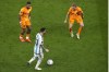 Argentina's Lionel Messi in action against Memphis Depay of the Netherlands, left, and Frenkie de Jong of the Netherlands during the World Cup quarterfinal soccer match between the Netherlands and Argentina, at the Lusail Stadium in Lusail, Qatar, Friday, Dec. 9, 2022. (AP Photo/Thanassis Stavrakis)