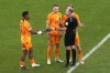 Referee Antonio Mateu gives to Jurrien Timber of the Netherlands his boot during the World Cup quarterfinal soccer match between the Netherlands and Argentina, at the Lusail Stadium in Lusail, Qatar, Saturday, Dec. 10, 2022. (AP Photo/Thanassis Stavrakis)