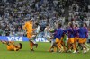Netherlands alternate players confront Argentina's Nahuel Molina, center,during the World Cup quarterfinal soccer match between the Netherlands and Argentina, at the Lusail Stadium in Lusail, Qatar, Friday, Dec. 9, 2022. (AP Photo/Ricardo Mazalan)