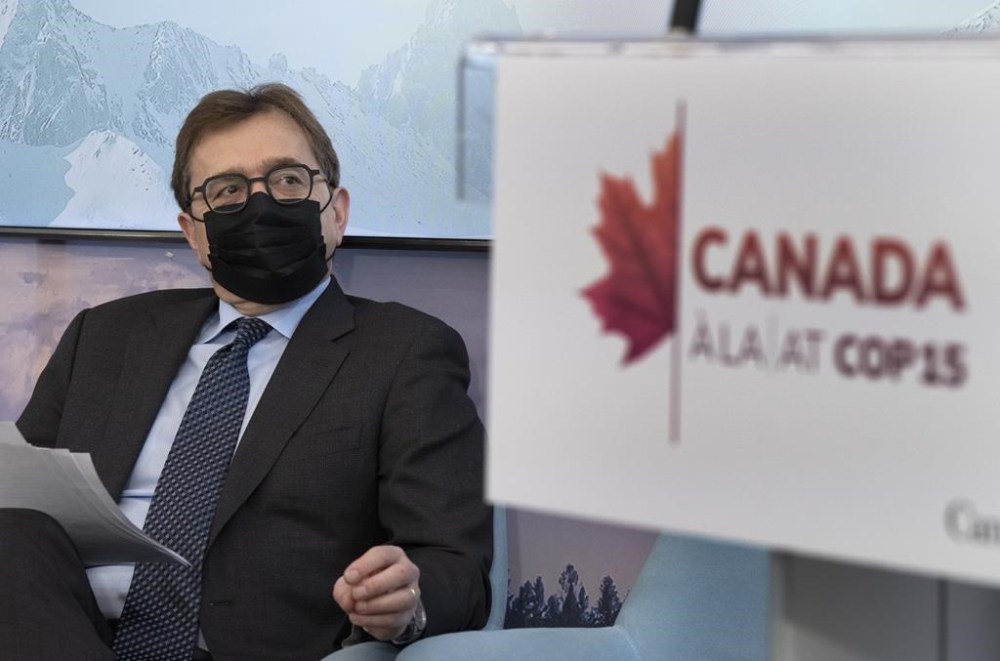 Federal Minister of Natural Resources Jonathan Wilkinson waits to speak to the media at the COP15 biodiversity conference Monday, December 12, 2022 in Montreal.THE CANADIAN PRESS/Ryan Remiorz