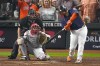 FILE - Houston Astros' Christian Vazquez, right, hits an RBI-single during the sixth inning in Game 6 of baseball's World Series against the Philadelphia Phillies, Nov. 5, 2022, in Houston. The Minnesota Twins added Vazquez on Monday, Dec. 12, 2022, agreeing to a $30 million, three-year contract with the veteran catcher. (AP Photo/Sue Ogrocki, File)