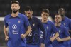 French soccer team player with Olivier Giroud, left, practise during a training session at the Jassim Bin Hamad stadium in Doha, Qatar, Monday, Dec. 12, 2022. France will play against Morocco during their World Cup semifinal soccer match on Dec. 14. (AP Photo/Christophe Ena)