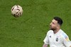 Argentina's Lionel Messi controls the ball during warm up before the World Cup semifinal soccer match between Argentina and Croatia at the Lusail Stadium in Lusail, Qatar, Tuesday, Dec. 13, 2022. (AP Photo/Pavel Golovkin)