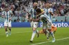 Argentina's Lionel Messi, left, and Argentina's Julian Alvarez celebrate after scoring during the World Cup semifinal soccer match between Argentina and Croatia at the Lusail Stadium in Lusail, Qatar, Tuesday, Dec. 13, 2022. (AP Photo/Martin Meissner)
