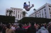 FILE - Moroccans celebrate in Rabat, Morocco, Saturday Dec. 10, 2022, after defeating Portugal in the quarterfinal soccer match of the World Cup played in Qatar. Every meeting of Morocco and France, the North African country's former colonial ruler, meet in an international tournament, emotions run high among players and their supporters. Family tales of colonial past emerge among the Moroccans and stories of harsh life of immigrants in France bubble up with questions of national loyalty pop up to French players with immigrant roots. (AP Photo/Mosa'ab Elshamy, File)
