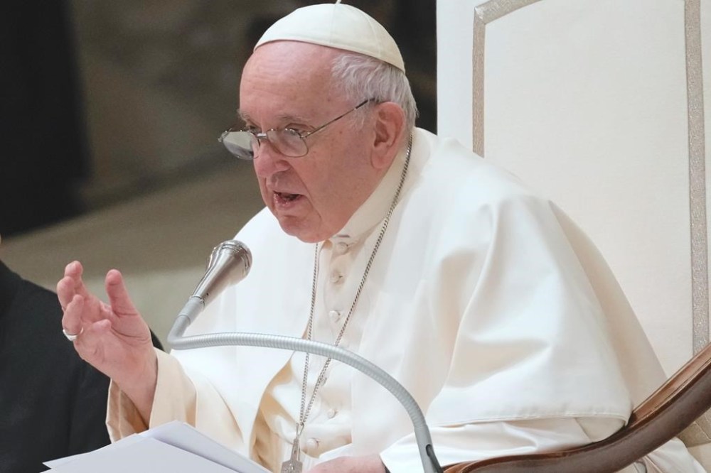 Pope Francis attends his weekly general audience in the Paul VI Hall at The Vatican, Wednesday, Dec. 14, 2022. (AP Photo/Domenico Stinellis)