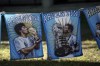 Flags featuring Maradona, left, and Messi, hang where Argentina soccer fans watch their team's World Cup semifinal match against Croatia, hosted by Qatar, on a screen set up in the Palermo neighborhood of Buenos Aires, Argentina, Tuesday, Dec.13, 2022. (AP Photo/Rodrigo Abd)