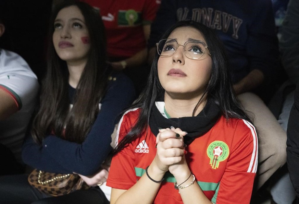 Moroccan fans react as they watch their team face France in the World Cup semifinals in a coffee shop in Montreal, on Wednesday, December 14, 2022. THE CANADIAN PRESS/Paul Chiasson
