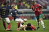 Morocco's Abde Ezzalzouli, on the ground, fights for the ball with France's Antoine Griezmann during the World Cup semifinal soccer match between France and Morocco at the Al Bayt Stadium in Al Khor, Qatar, Wednesday, Dec. 14, 2022. (AP Photo/Christophe Ena)