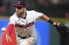FILE - Cleveland Guardians first baseman Owen Miller flips the ball to first base for the out on Arizona Diamondbacks' Seth Beer during the seventh inning of a baseball game, Tuesday, Aug. 2, 2022, in Cleveland. The Milwaukee Brewers have acquired infielder Owen Miller from the Cleveland Guardians for a player to be named and cash. (AP Photo/David Dermer, File)