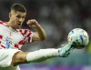 Croatia's Andrej Kramaric kicks the ball during the World Cup group F soccer match between Croatia and Belgium at the Ahmad Bin Ali Stadium in Al Rayyan, Qatar, Thursday, Dec. 1, 2022. (AP Photo/Francisco Seco)