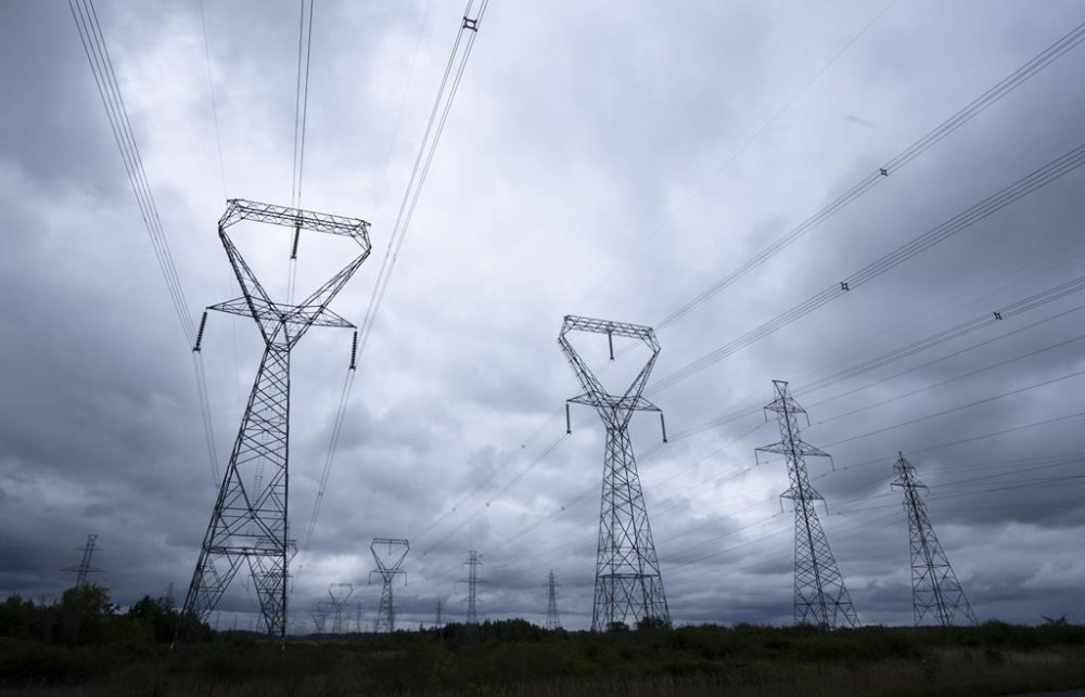 Power lines are seen against cloudy skies near Kingston, Ont., Wednesday, Sept. 7, 2022. Ontario is staring down an electricity supply crunch and amid a rush to secure more power, it is plunging into the world of storage -- a relatively unknown solution for the grid that experts say could also change energy use at home. THE CANADIAN PRESS/Adrian Wyld