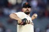 FILE - San Francisco Giants' Carlos Rodón pitches against the Colorado Rockies during the first inning of a baseball game in San Francisco, on Sept. 29, 2022. The New York Yankees added Rodón to their rotation on Thursday, Dec. 15, 2022, agreeing to a $162 million, six-year contract with the left-hander. (AP Photo/Godofredo A. Vásquez, File)