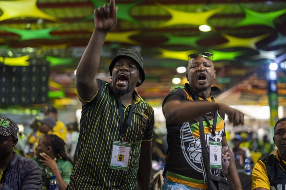 Pro Jacob Zuma delegates shout at South African President Cyril Ramaphosa at the African National Congress national conference in Johannesburg, South Africa, Friday Dec. 16, 2022. The conference will elect the party's leadership and adopt key policies for governing the country. President Cyril Ramaphosa is seeking re-election as the party's leader at the national conference which is held every five years and is the ANC's highest decision-making body. (AP Photo/Jerome Delay)