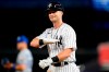 FILE - New York Yankees' Andrew Benintendi gestures toward teammates after hitting an RBI-single during the eighth inning of a baseball game against the Kansas City Royals, on July 29, 2022, in New York. The Chicago White Sox agreed to a $75 million, five-year contract with All-Star outfielder Andrew Benintendi, a person familiar with the situation said Friday, Dec. 16, 2022. (AP Photo/Frank Franklin II)