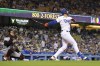FILE - Los Angeles Dodgers' Joey Gallo, right, hits a solo home run as Arizona Diamondbacks catcher Carson Kelly watches during the second inning of a baseball game on Sept. 19, 2022, in Los Angeles. Gallo and the Minnesota Twins agreed to an $11 million, one-year contract, a person familiar with the negotiations told The Associated Press on Friday, Dec. 16, 2022, a deal that gives Minnesota another left-handed-hitting outfielder. (AP Photo/Mark J. Terrill, File)