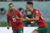 Morocco's Achraf Dari, right, celebrates after scoring his side's first goal during the World Cup third-place playoff soccer match between Croatia and Morocco at Khalifa International Stadium in Doha, Qatar, Saturday, Dec. 17, 2022. (AP Photo/Francisco Seco)